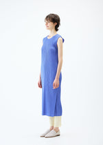 A model wears the PLEATS PLEASE ISSEY MIYAKE MONTHLY COLORS MARCH dress.