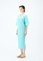 A model wears the PLEATS PLEASE ISSEY MIYAKE MONTHLY COLORS APRIL dress.