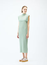 A model wears the PLEATS PLEASE ISSEY MIYAKE MONTHLY COLORS : JUNE dress.