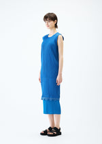 A model wears the PLEATS PLEASE ISSEY MIYAKE TWINKLE dress.