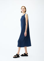 A model wears the PLEATS PLEASE ISSEY MIYAKE LAMP SHADE dress.