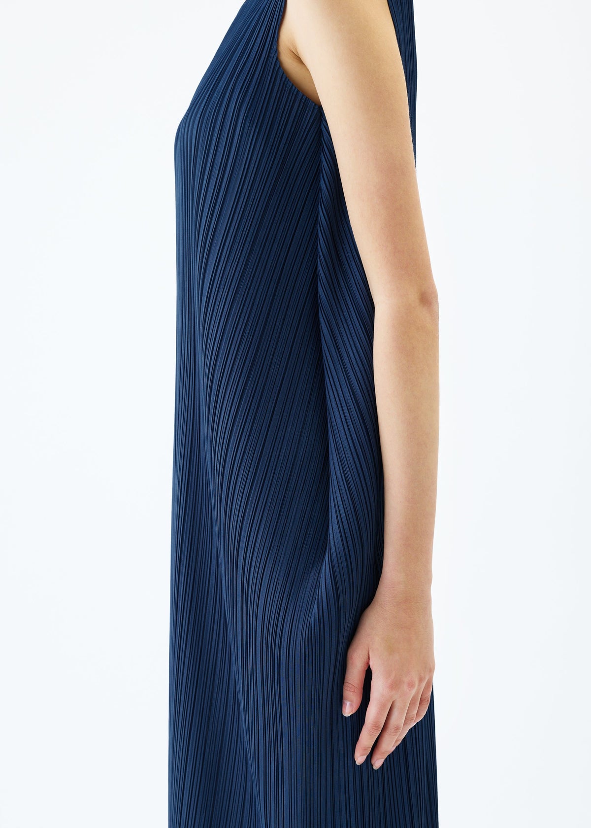 A model wears the PLEATS PLEASE ISSEY MIYAKE LAMP SHADE dress.