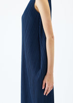 A model wears the PLEATS PLEASE ISSEY MIYAKE LAMP SHADE dress.