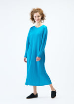 A model wears the PLEATS PLEASE ISSEY MIYAKE LANTERN dress.