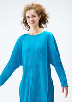 A model wears the PLEATS PLEASE ISSEY MIYAKE LANTERN dress.