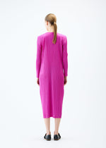 A model wears the PLEATS PLEASE ISSEY MIYAKE LIGHT WAVE dress.