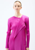 A model wears the PLEATS PLEASE ISSEY MIYAKE LIGHT WAVE dress.