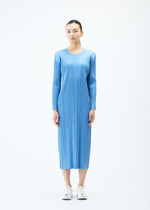 A model wears the PLEATS PLEASE ISSEY MIYAKE COTTON DENIM dress.