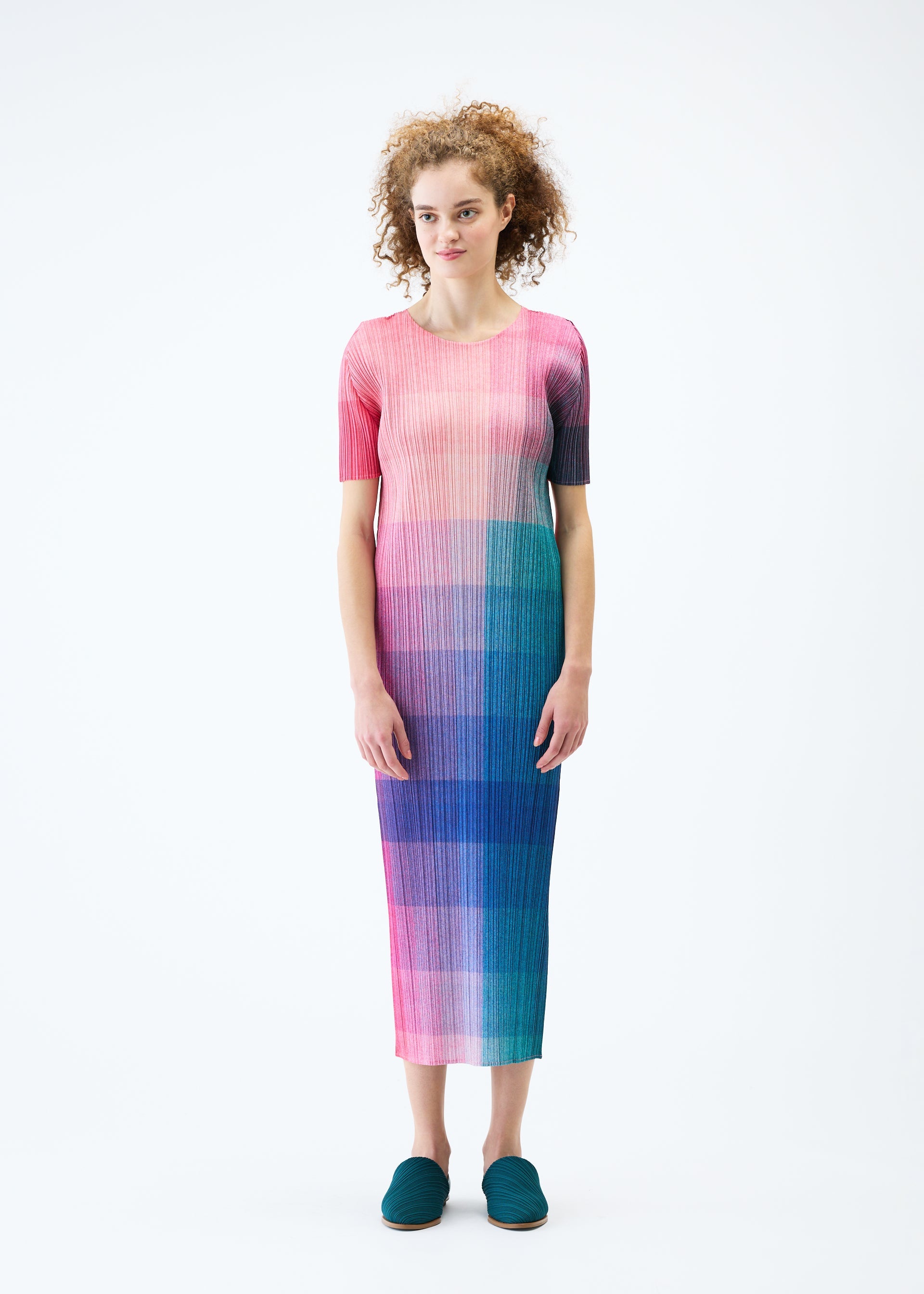 A model wears the PLEATS PLEASE ISSEY MIYAKE PHOTON dress.