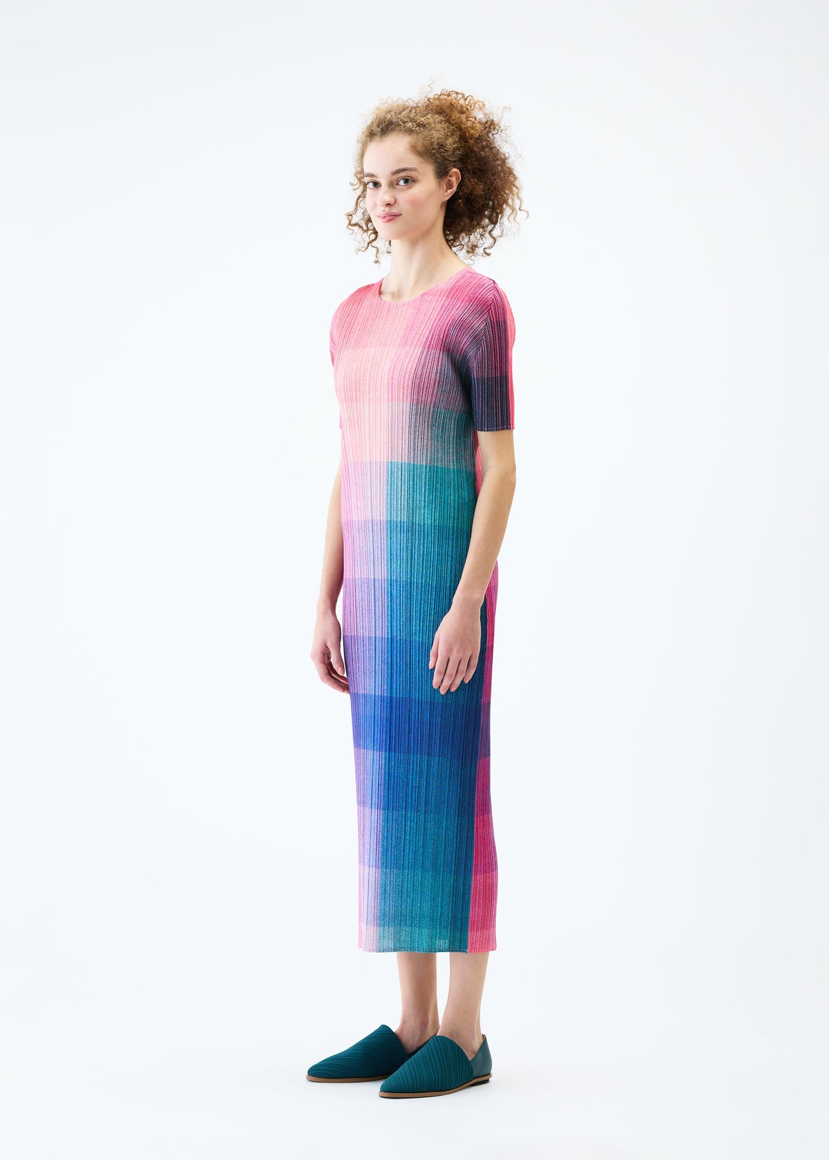 A model wears the PLEATS PLEASE ISSEY MIYAKE PHOTON dress.