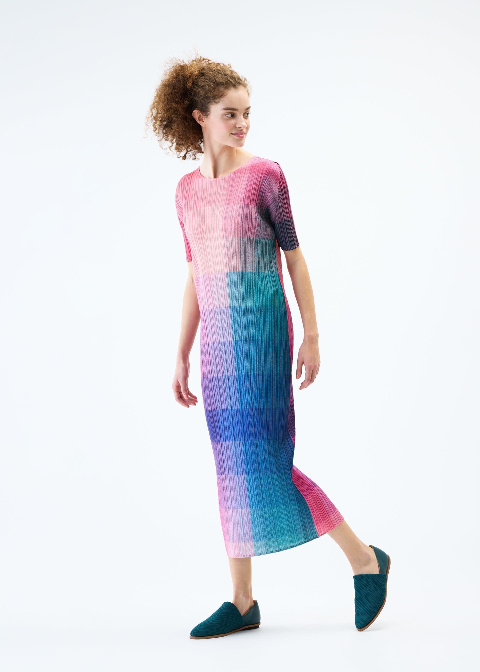 A model wears the PLEATS PLEASE ISSEY MIYAKE PHOTON dress.