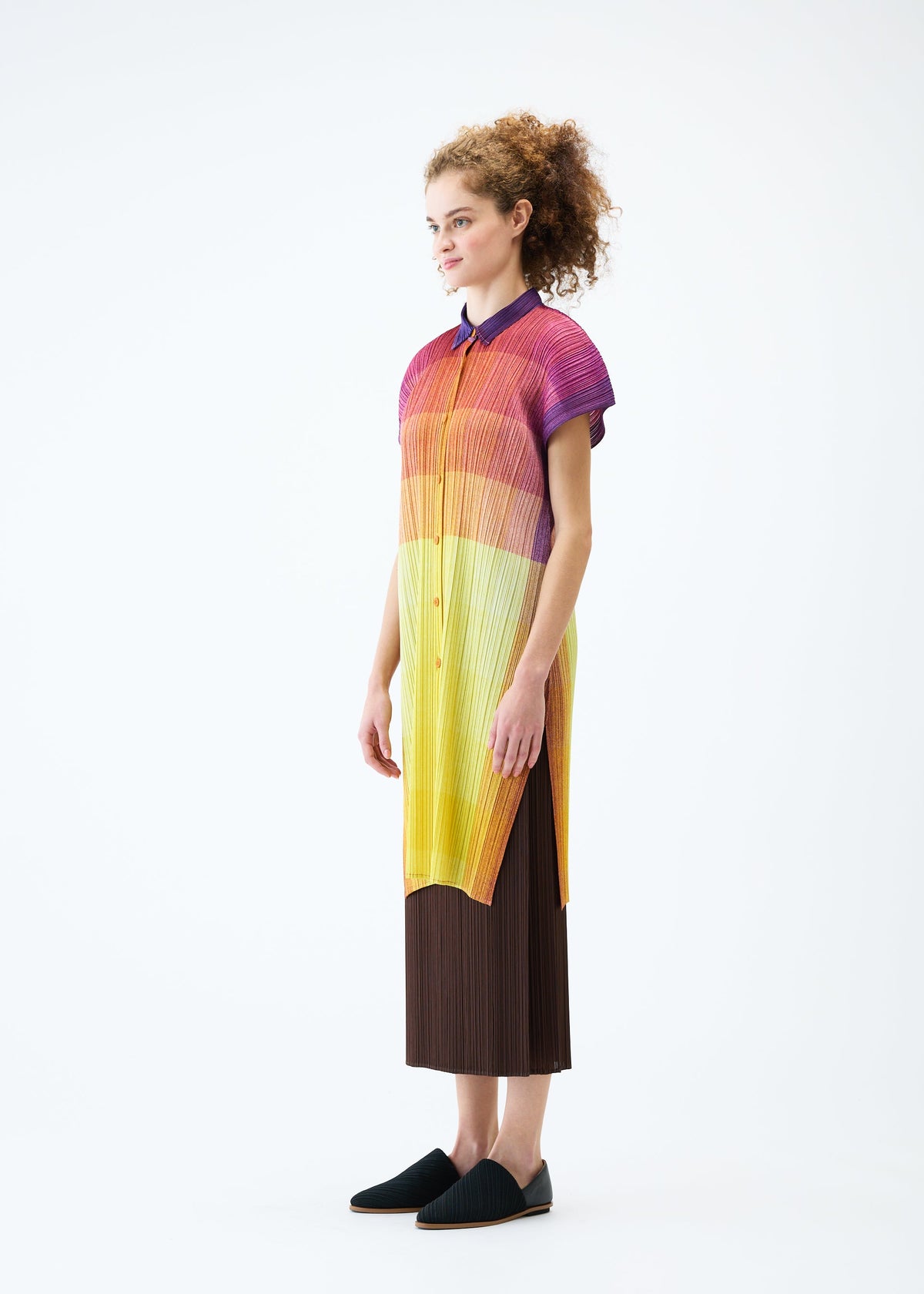 A model wears the PLEATS PLEASE ISSEY MIYAKE PHOTON shirt.