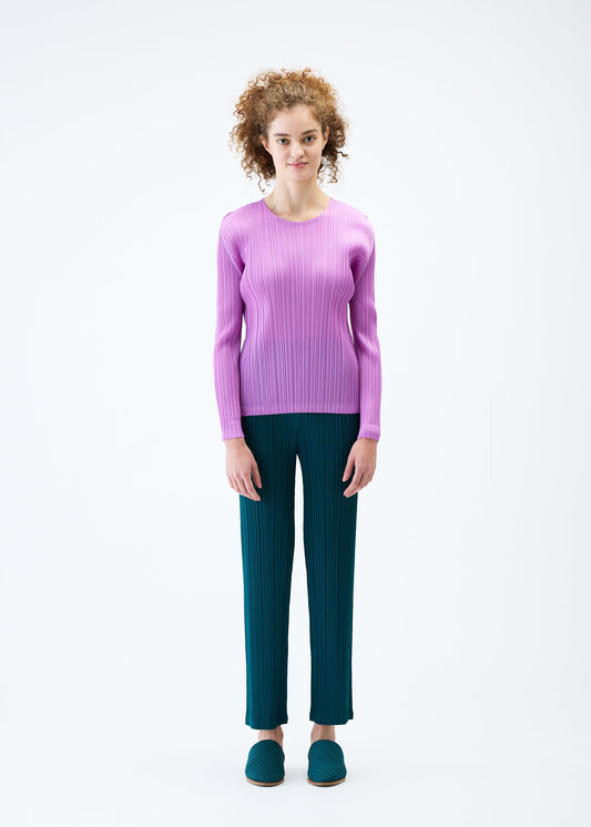 A model wears the PLEATS PLEASE ISSEY MIYAKE MONTHLY COLORS JANUARY top.