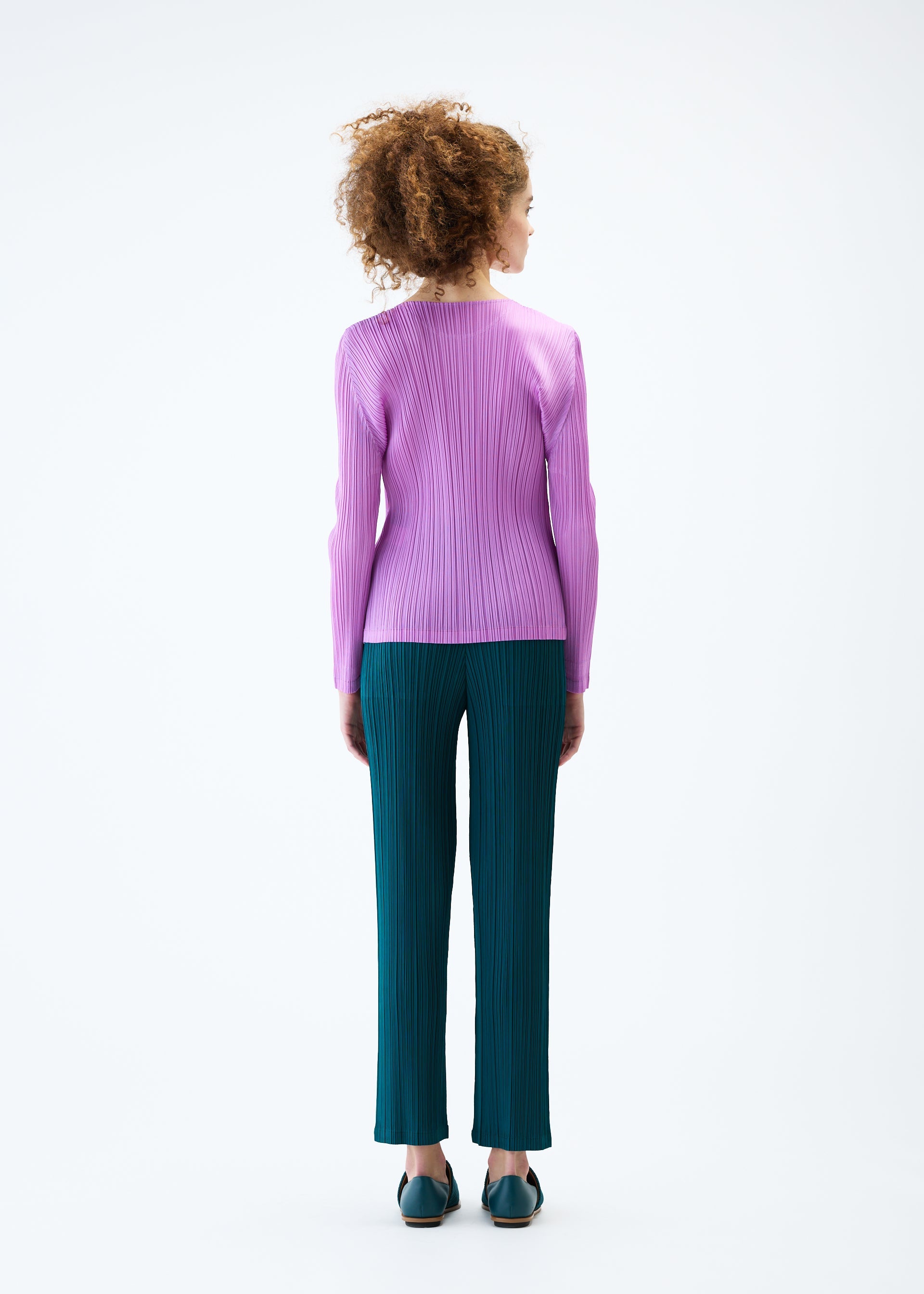 A model wears the PLEATS PLEASE ISSEY MIYAKE MONTHLY COLORS JANUARY top.