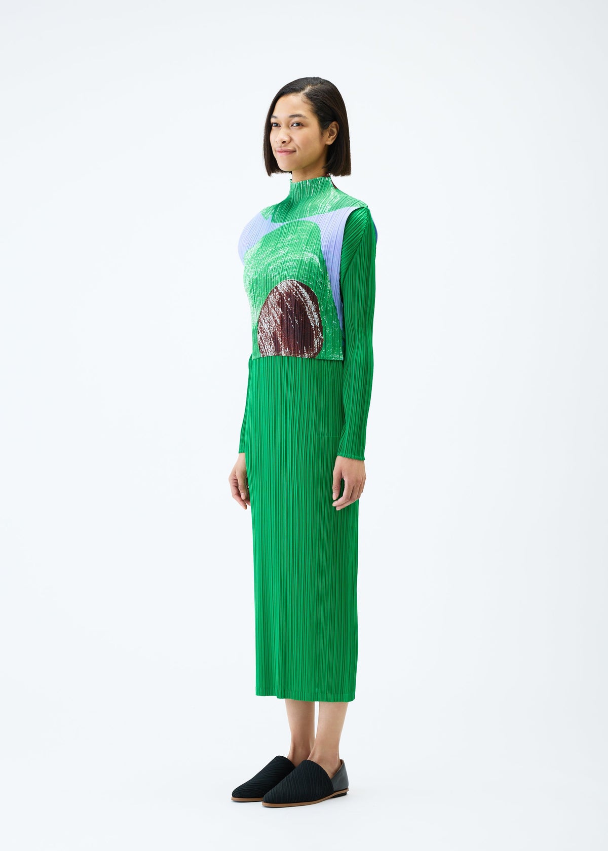A model wears the PLEATS PLEASE ISSEY MIYAKE BACKLIGHT top.