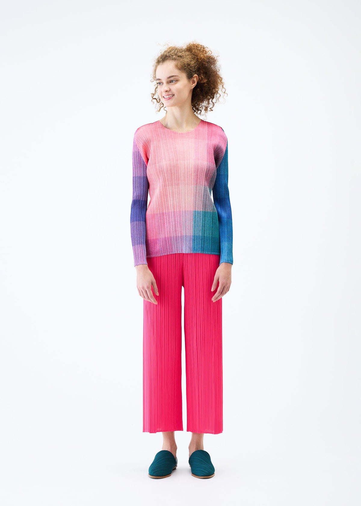 A model wears the PLEATS PLEASE ISSEY MIYAKE PHOTON top.