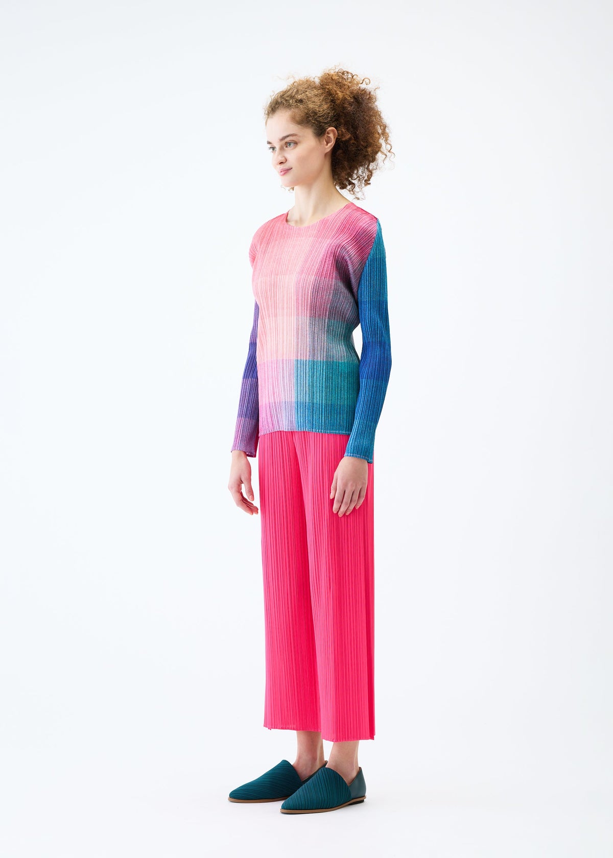 A model wears the PLEATS PLEASE ISSEY MIYAKE PHOTON top.