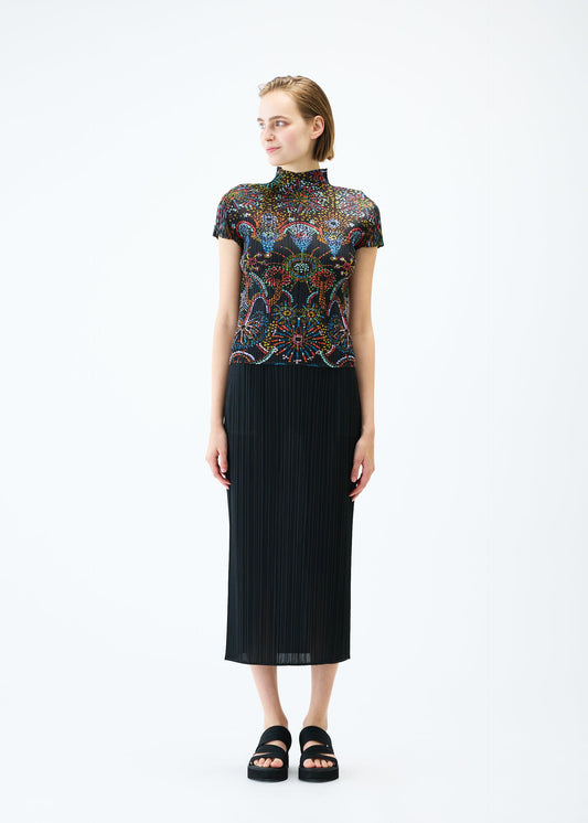 A model wears the PLEATS PLEASE ISSEY MIYAKE LIGHT FESTIVAL top.