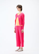 A model wears the PLEATS PLEASE ISSEY MIYAKE MONTHLY COLORS MARCH cardigan.