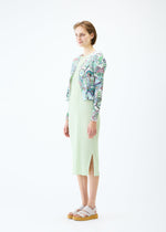 A model wears the PLEATS PLEASE ISSEY MIYAKE LIGHT FESTIVAL cardigan.