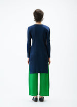 A model wears the PLEATS PLEASE ISSEY MIYAKE MONTHLY COLORS FEBRUARY tunic.