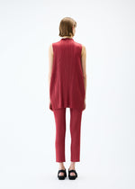 A model wears the PLEATS PLEASE ISSEY MIYAKE LAMP SHADE tunic.