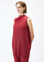 A model wears the PLEATS PLEASE ISSEY MIYAKE LAMP SHADE tunic.
