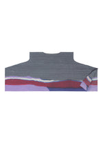 A detail shot of the PLEATS PLEASE ISSEY MIYAKE GRAINY COLORS tunic.