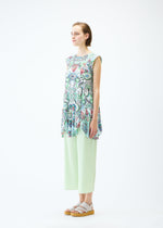 A model wears the PLEATS PLEASE ISSEY MIYAKE LIGHT FESTIVAL tunic.