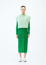 A model wears the PLEATS PLEASE ISSEY MIYAKE CREPE KNIT vest.