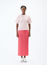 A model wears the PLEATS PLEASE ISSEY MIYAKE JIGGLY KNIT top.