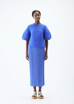 A model wears the PLEATS PLEASE ISSEY MIYAKE MUSHROOM KNIT top.