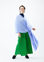A model wears the PLEATS PLEASE ISSEY MIYAKE MADAME T FEBRUARY stole.