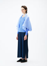 A model wears the PLEATS PLEASE ISSEY MIYAKE ZIGZAG PLEATS SCARF stole.
