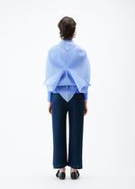 A model wears the PLEATS PLEASE ISSEY MIYAKE ZIGZAG PLEATS SCARF stole.