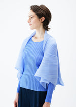A model wears the PLEATS PLEASE ISSEY MIYAKE ZIGZAG PLEATS SCARF stole.