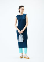 A model wears the PLEATS PLEASE ISSEY MIYAKE PLEATS TOTE BAG bag.