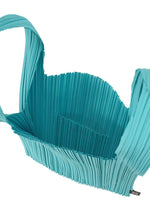 A detail shot of the PLEATS PLEASE ISSEY MIYAKE PLEATS SHOPPING TOTE bag.