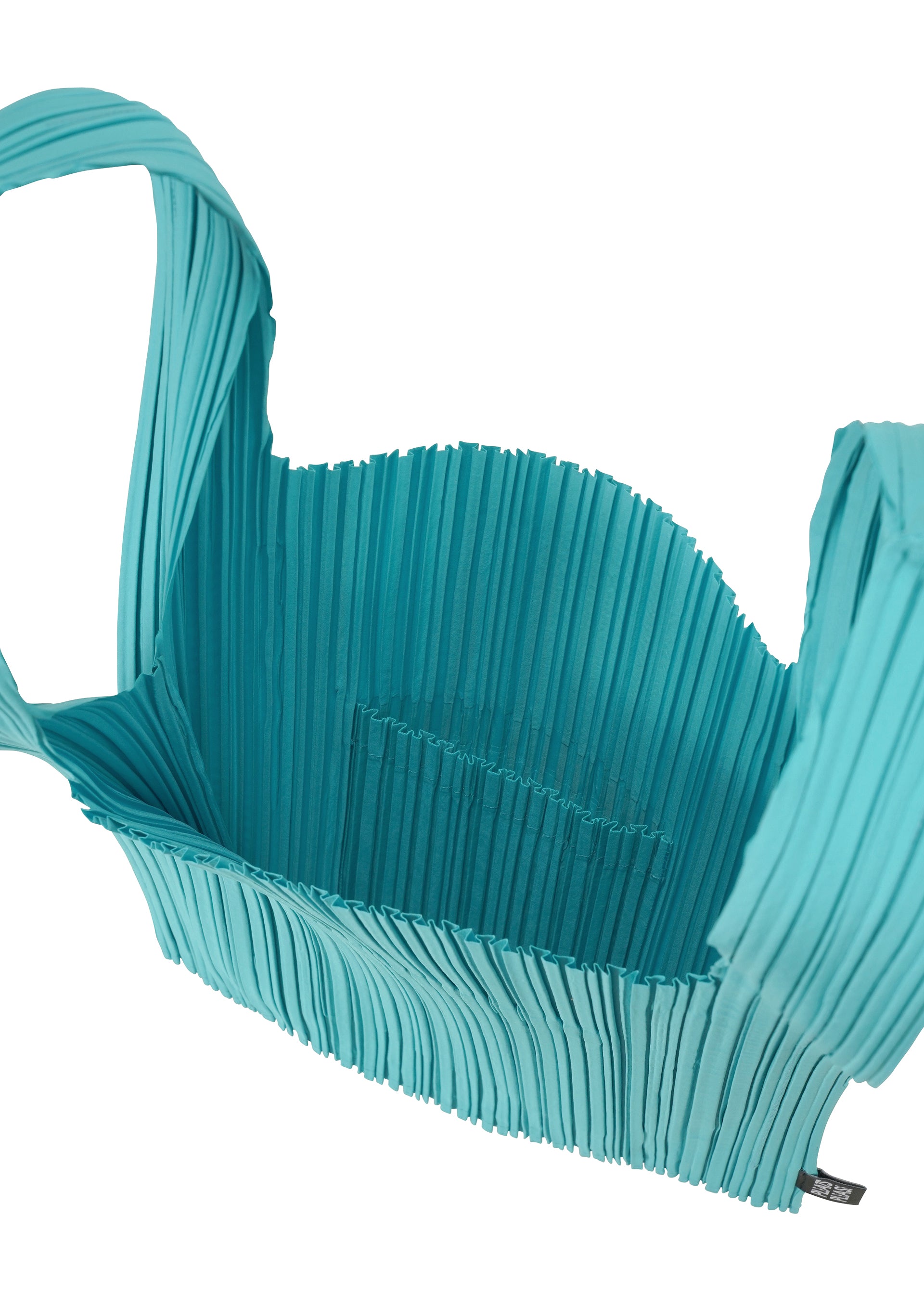 A detail shot of the PLEATS PLEASE ISSEY MIYAKE PLEATS SHOPPING TOTE bag.