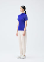 A model wears the PLEATS PLEASE ISSEY MIYAKE MIST SEPTEMBER top.