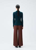 A model wears the PLEATS PLEASE ISSEY MIYAKE RIB PLEATS NOVEMBER top.