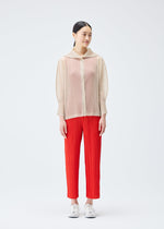 A model wears the PLEATS PLEASE ISSEY MIYAKE TATAMI JULY cardigan.