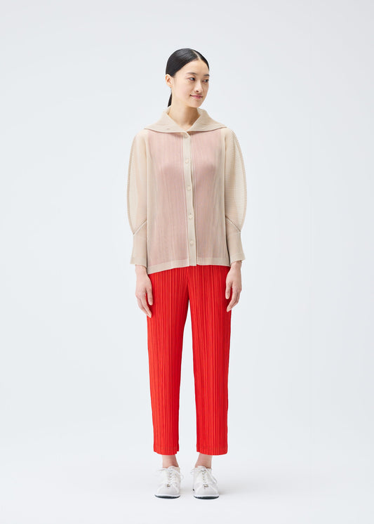 A model wears the PLEATS PLEASE ISSEY MIYAKE TATAMI JULY cardigan.