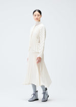 A model wears the PLEATS PLEASE ISSEY MIYAKE CIRCULAR cardigan.