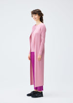 A model wears the PLEATS PLEASE ISSEY MIYAKE MONTHLY COLORS SEPTEMBER coat.