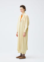 A model wears the PLEATS PLEASE ISSEY MIYAKE MONTHLY COLORS DECEMBER clothing.