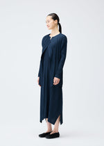 A model wears the PLEATS PLEASE ISSEY MIYAKE MELLOW PLEATS coat.