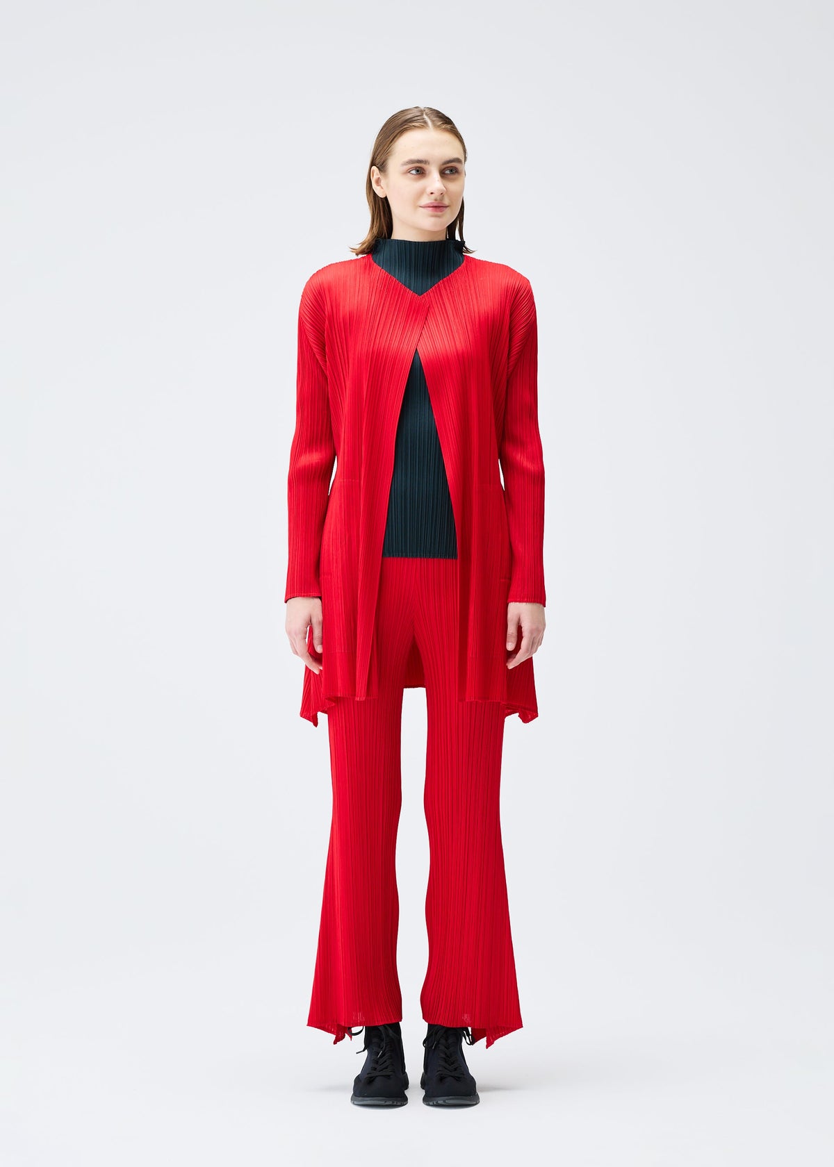 A model wears the PLEATS PLEASE ISSEY MIYAKE OLE! clothing.