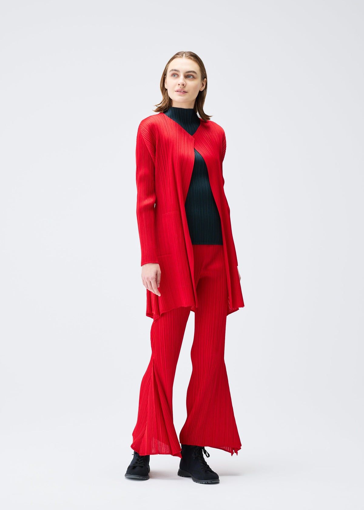 A model wears the PLEATS PLEASE ISSEY MIYAKE OLE! clothing.