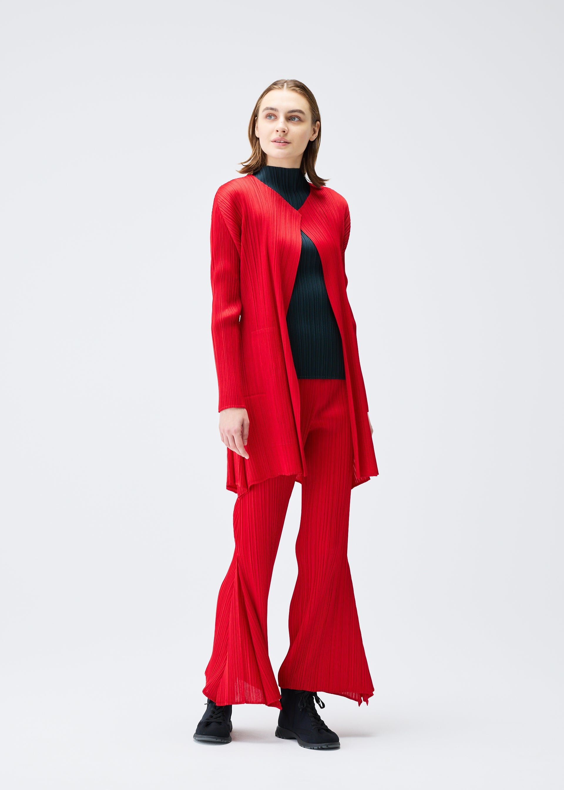 A model wears the PLEATS PLEASE ISSEY MIYAKE OLE! clothing.